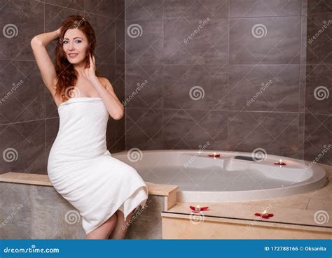 Redhead Woman Sitting Near A Hot Tub Stock Photo Image Of Candles Hydro