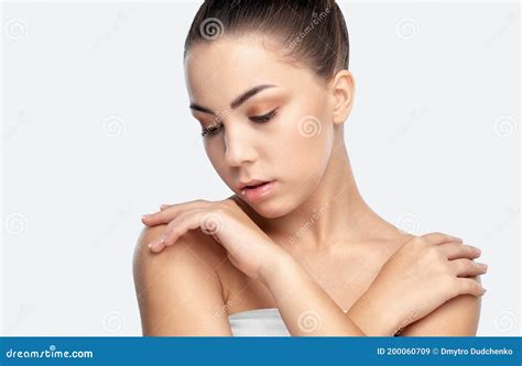 Portrait Of A Beautiful Charming Brunette Woman With Healthy Clean Skin And Fresh Make Up