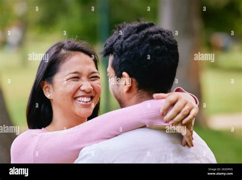 Happy Asian Couple Looking In Love While Standing Face To Face In A