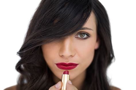 Premium Photo Glamorous Brunette Applying Red Lipstick