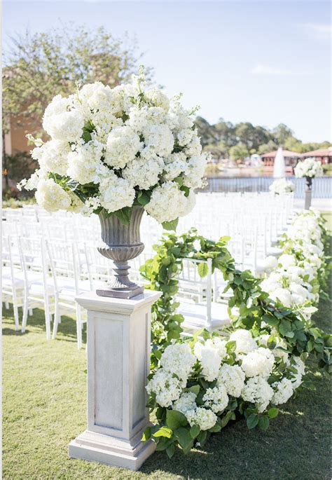 Outdoor Wedding Ceremony Featured Large And Lush Traditional Urns