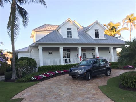 like the gray metal roof on the white house... | Farmhouse style house ...