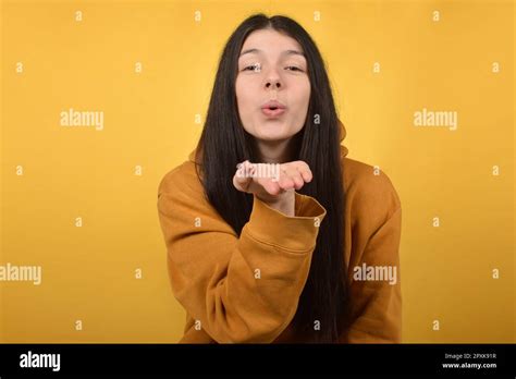 Cute Pretty Brunette Woman Makes An Air Kiss Stock Photo Alamy