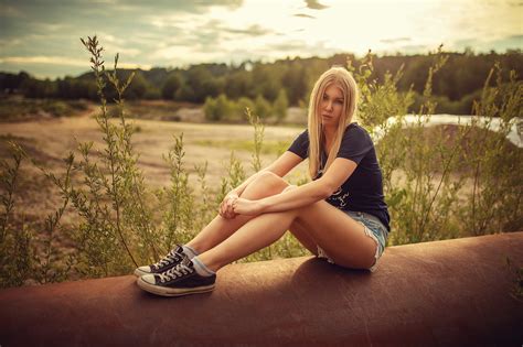 Women Blonde Sitting Socks Jean Shorts T Shirt Sneakers