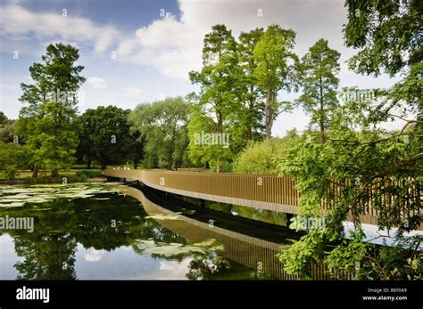 View Of The Sackler Crossing Over The Lake In Kew Gardens Stock Photo