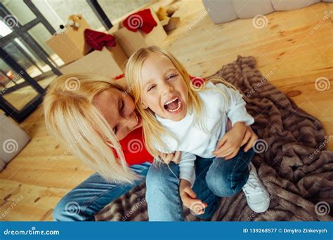 Cheerful Blonde Girl Laughing While Being Tickled Stock Image Image Of Daughter Interaction