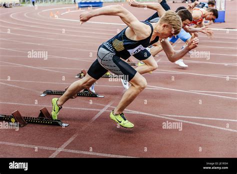 start sprinters runners men running 100 meters during UrFO Championship ...