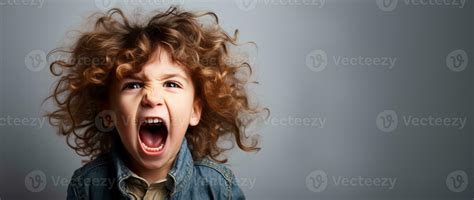 A single child screaming in frustration isolated on a white background