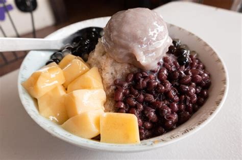 Premium Photo Eating Shaved Ice With Colorful Dessert