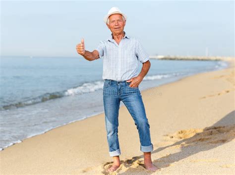 Satisfied Mature Man Giving Thumbs Up Stock Photo Image Of Pastime