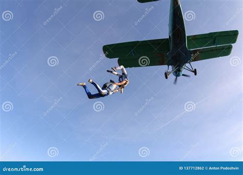 Skydivers Have Jumped Out Of A Green Biplane Stock Photo Image Of