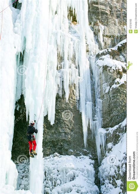 Man Climbing Frozen Waterfall Stock Image Image Of Crampons Extreme