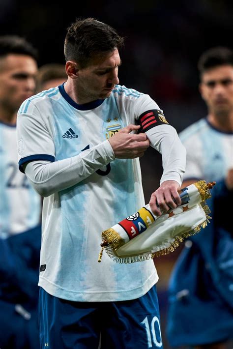 MADRID, SPAIN - MARCH 22: Leo Messi of Argentina adjusts his captain ...