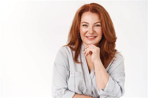 Premium Photo Good Looking Sincere Redhead Mature Female Listen Curiously Smiling Delighted