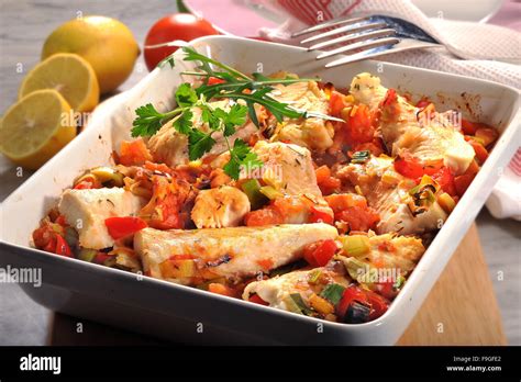 Baked Fish With Tomatoes And Leek Stock Photo Alamy