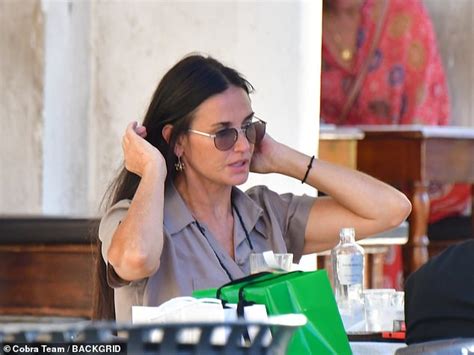 Demi Moore Showcases Her Bikini Body As She Jumps High Into The