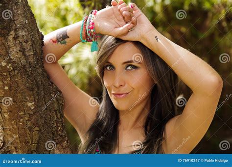 Headshot Pretty Brunette Standing Between Trees Bare Skinned Arms Above Head Pose Sensually