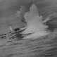 Немецкая подлодка U-210 во время ее атаки канадским эсминцем ...