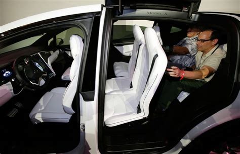 Tesla Debuts Model X Suv With Delorean Style Gullwing Doors Eandt