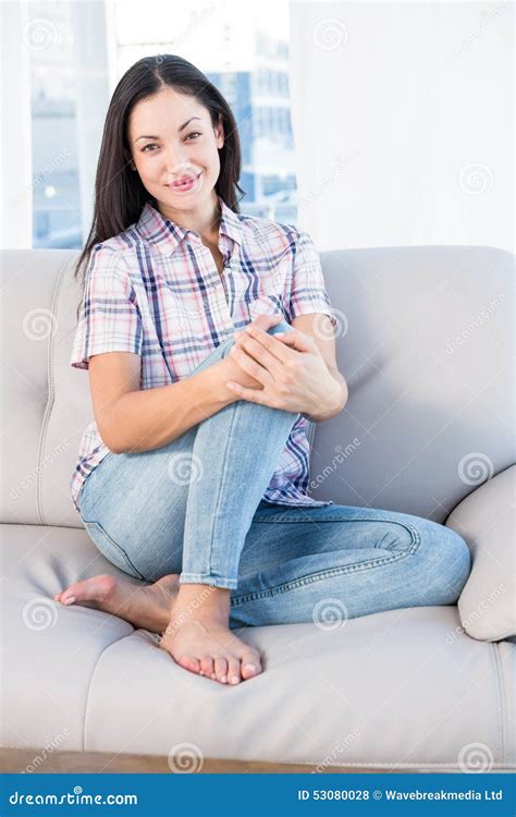 Pretty Brunette Looking At Camera And Sitting On Couch Stock Photo Image Of Hair Home 53080028