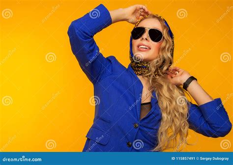 Fashion Portrait Of A Beautiful Blonde In A Blue Scarf And Jacket In
