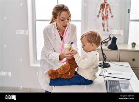 Mother And Son Having Pediatrician Consultation At Clinic Stock Photo