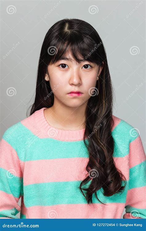 Studio Portrait of a Teenage East Asian Woman Looking Sideways Stock ...