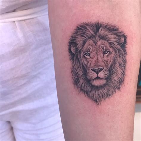 lion tattoo on forearm