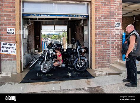 Women Dressed In Bikinis Wash Motorcycles At Bikini Bike Wash During