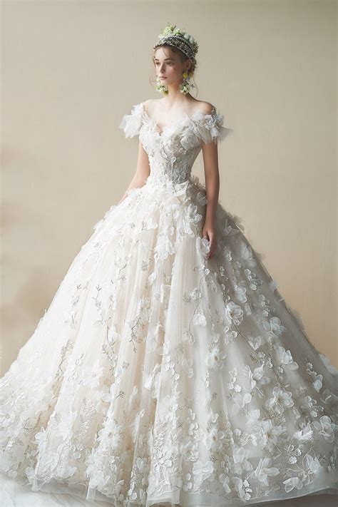 15 Ethereal Flower Inspired Wedding Dresses For Your White Garden