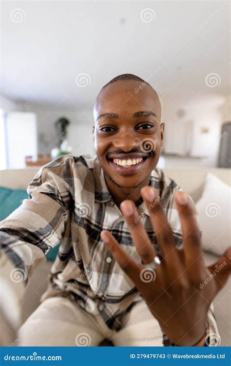 African American Gay Man With Short Hair Showing Wedding Ring While