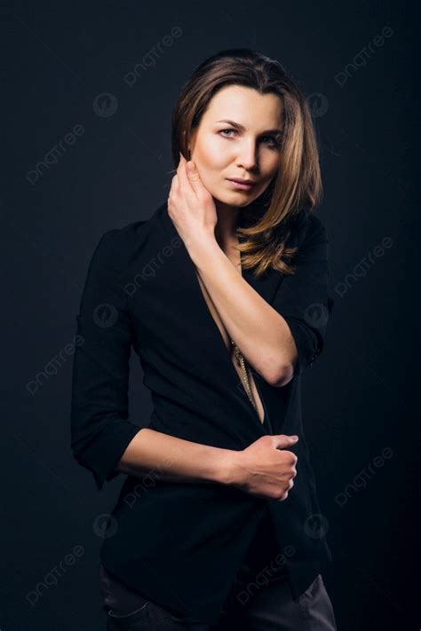 Girl Brunette Beauty Model In A Black Jacket On A Dark Blue Background Photo And Picture For