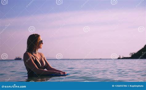 The Girl The Blonde In A Black Bathing Suit And Black Glasses A Beautiful Model With A Body