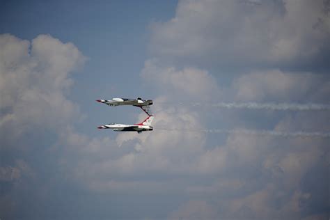 Fighter Jet Doing A Barrel Roll Above Another Fighter Jet · Free Stock