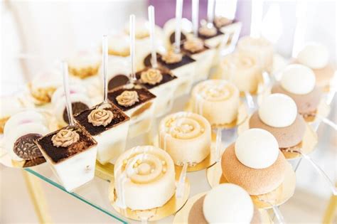 Premium Photo Assortment Of Pieces Of Cake On Messy Table