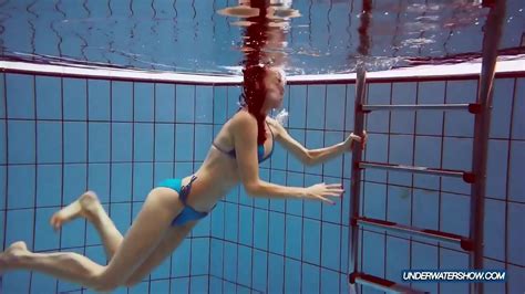 Redhead In Blue Bikini Showing Her Body