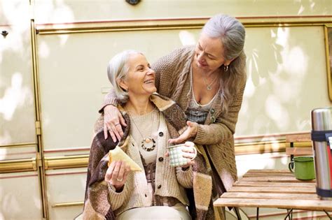 A Lesbian Couple Enjoys A Cozy Stock Photo Image Of Laughter Outdoorsy