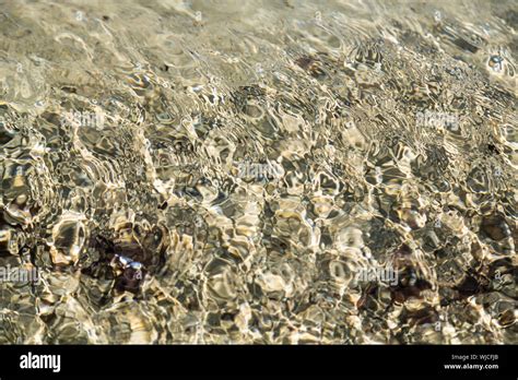 Clear Ocean Water Surface With Reflections For Backgrounds Stock Photo