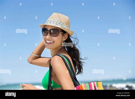 Beautiful woman smiling on the beach Stock Photo - Alamy