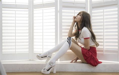 K K Asian Brunette Girl Sitting Side Skirt Hands Legs Stilettos Knee Highs HD