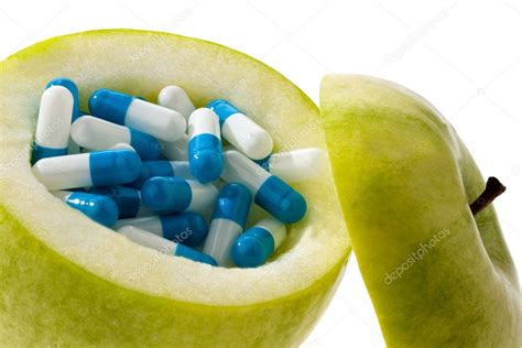 Apple tablets with capsules. — Stock Photo © ginasanders #8731180