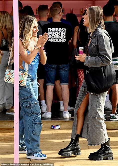 Demi Sims Puts On A VERY Busty Display In A Black PVC Bikini Top As She Cosies Up To On Off