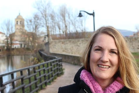 Happy Mature Woman Hiking In The Woods With Copyspace On The Left Side Of The Picture Stock