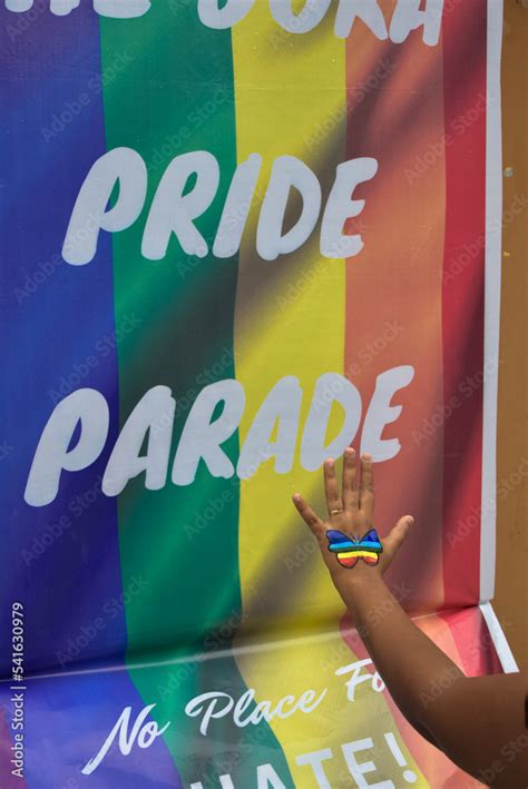 Rainbow Gay Pride Flag Freedom Flag And Human Hand With Rainbow Gay Pride Tattoo Design On