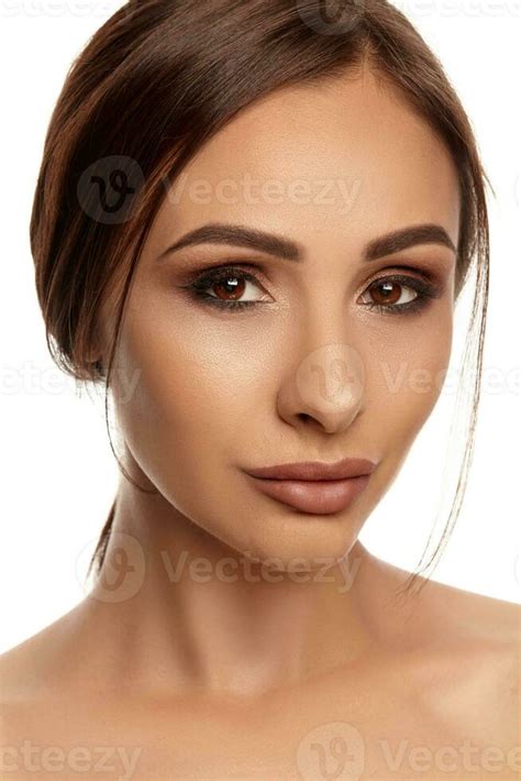 Close Up Portrait Of A Brunette Nude Model Girl With Professional Evening Make Up And Plump Lips