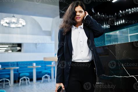 gorgeous indian woman wear formal posing  cafe  bar counter
