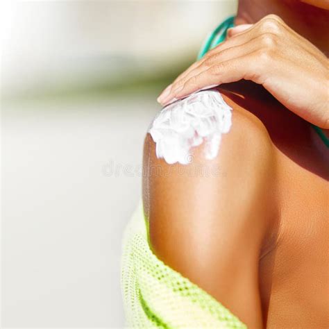 Woman Applying Sunscreen On Her Shoulder Stock Image Image Of