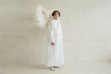 A woman dressed in a white angel costume photo – Angel Image on Unsplash