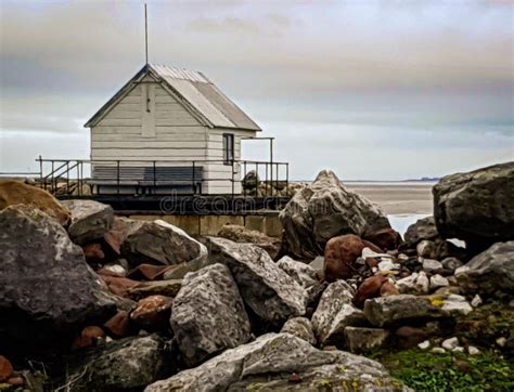 white wooden shed  dockyard   rocks stock image image