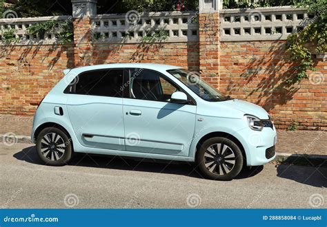 Light Blue New Renault Twingo At The Road Side Brick Wall On
